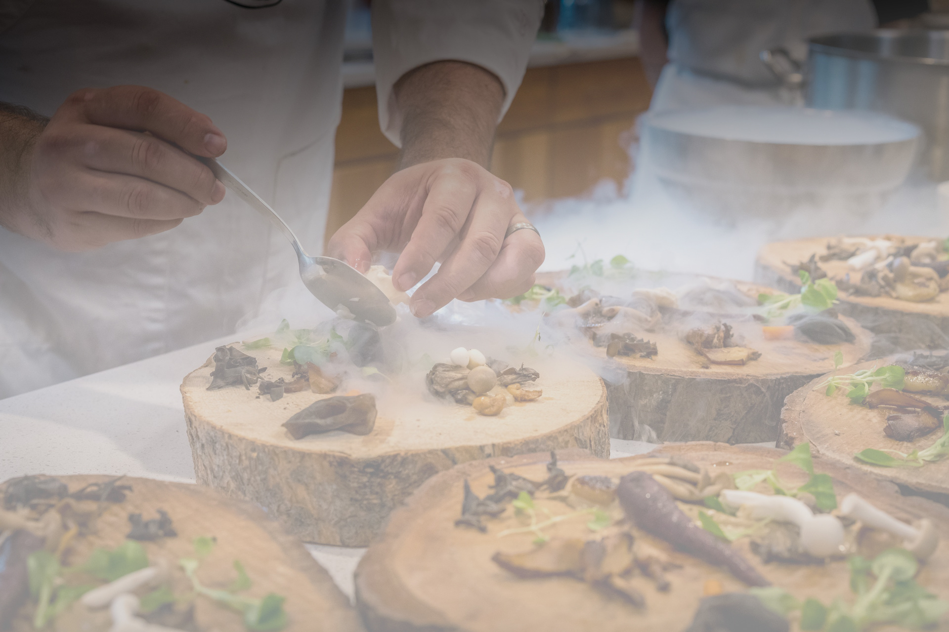 chef-preparing-vegetable-dish-on-tree-slab-12673202